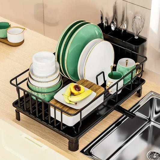 Rustproof Dish Drying Rack for kitchen countertop, holding plates, cups, and utensils, with a stylish black design.